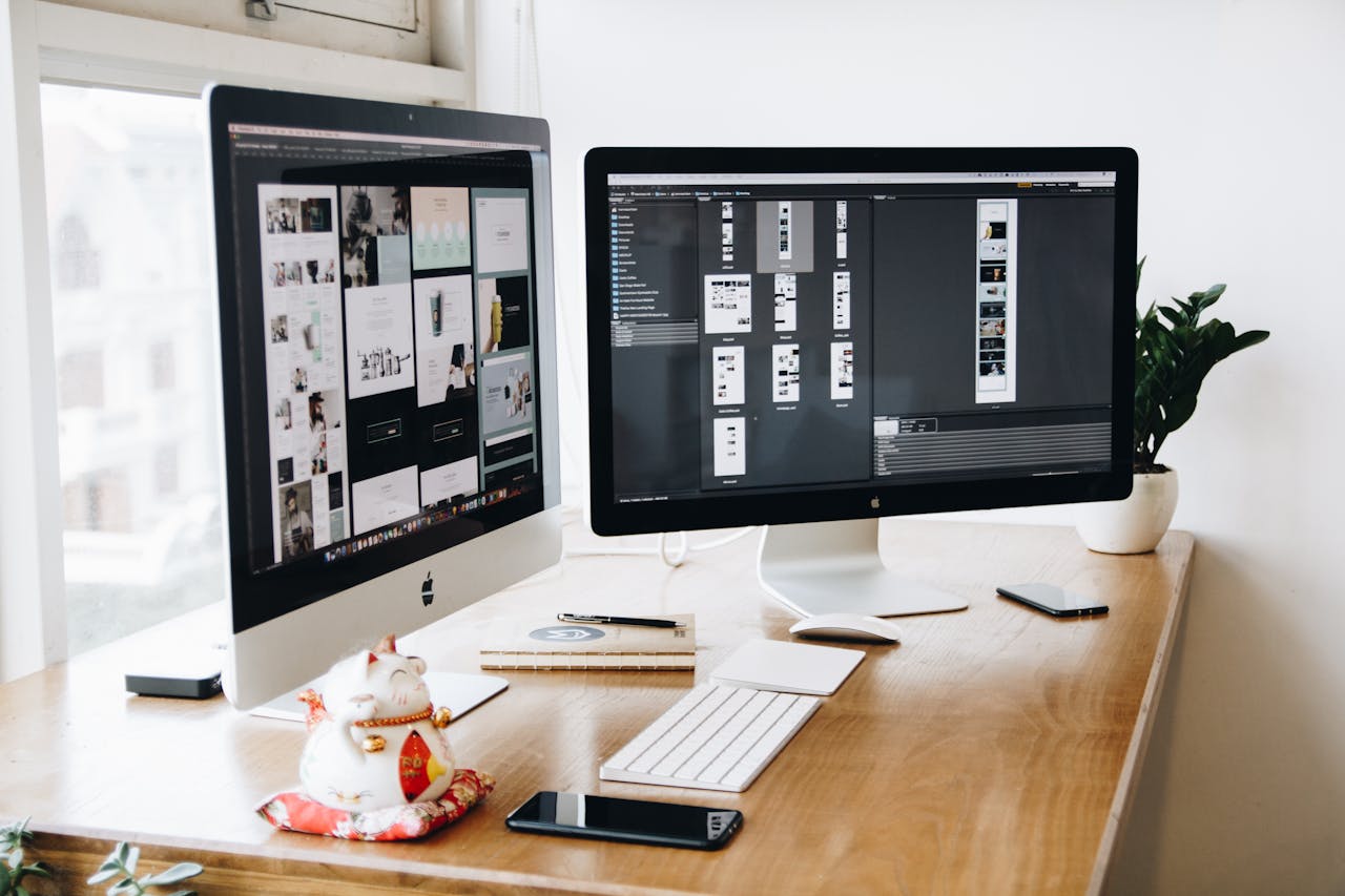 our-services-3 A well-organized design workspace with dual monitors and design software on display.